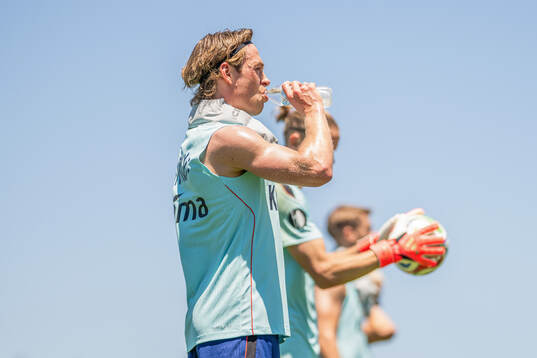 Patrick Berg of the Norwegian national football team drinks