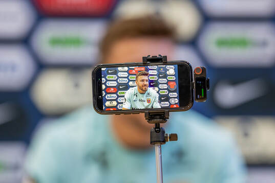 An iPhone shows Fredrik André Bjørkan of the Norwegian