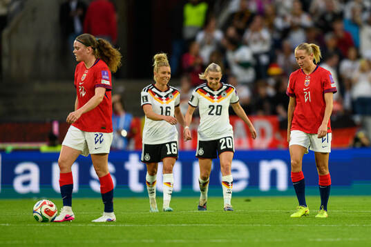Signe Gaupset and Lisa Naalsund of Norway look dejected