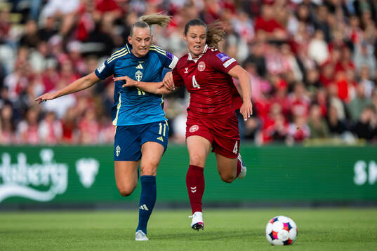 Stina Blackstenius of Sweden and Emma Skou Færge of Denmark