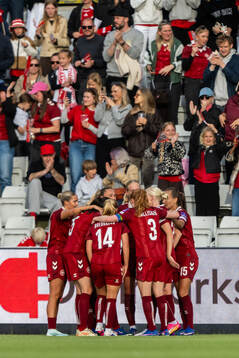 Cecilie Fløe Nielsen of Denmark celebrates with team mates