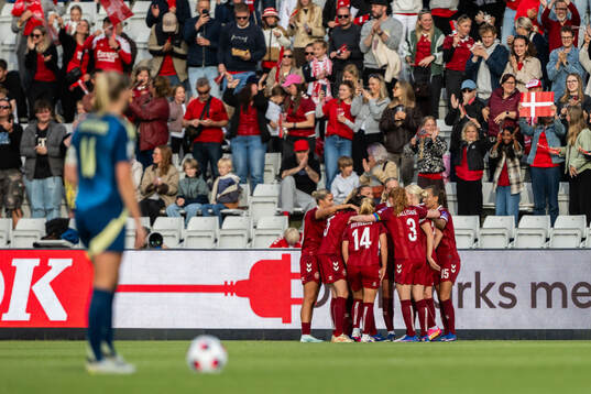 Cecilie Fløe Nielsen of Denmark celebrates with team mates