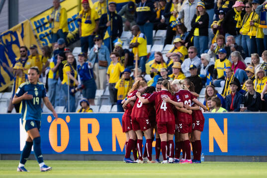 Pernille Harder of Denmark celebrates with team mates