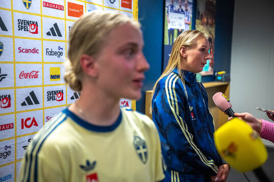 Anna Sandberg and Stina Blackstenius of Sweden in mixed zone