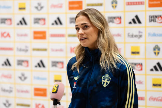 Fridolina Rolfö at a press event with the women's national