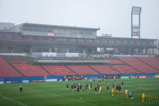 Players of the Swedish national football team in the rain