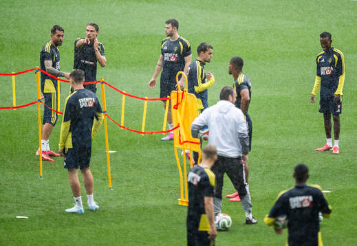 Players of the Swedish national football team in the rain