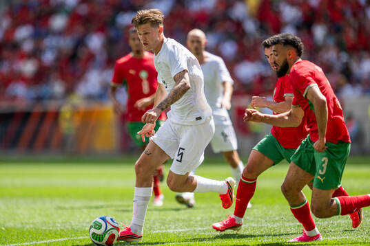 David Møller Wolfe of Norway and Noussair Mazraoui of