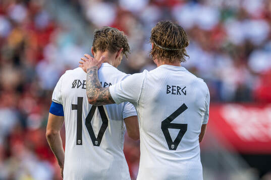 Martin Ødegaard of Norway celebrates with Patrick Berg
