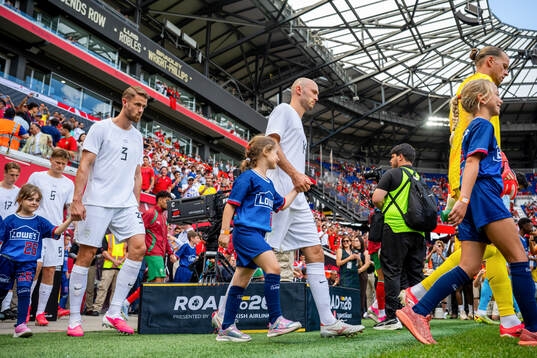 Kristoffer Ajer and Fredrik Aursnes of Norway enter the