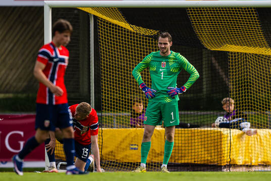 Rasmus Holten and goalkeeper Martin Børsheim of Norway