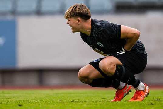 Goalkeeper Ukko Happonen of Finland in pain