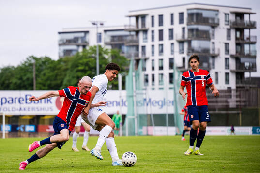 Marius Broholm of Norway and David Ezeh of Finland