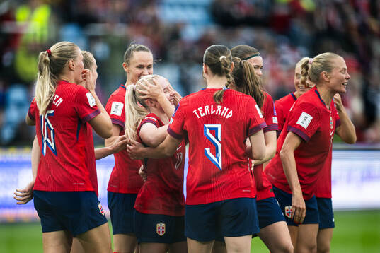 Thea Bjelde of Norway celebrates with teammates