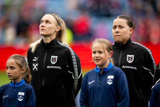 Sarah Puntigam and goalkeeper Mariella El Sherif of Austria