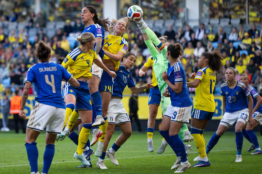 Martina Piemonte and goalkeeper Laura Giuliani of Italy