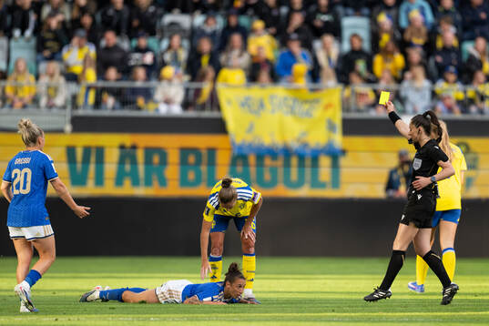 Filippa Angeldahl of Sweden receives a yellow card from