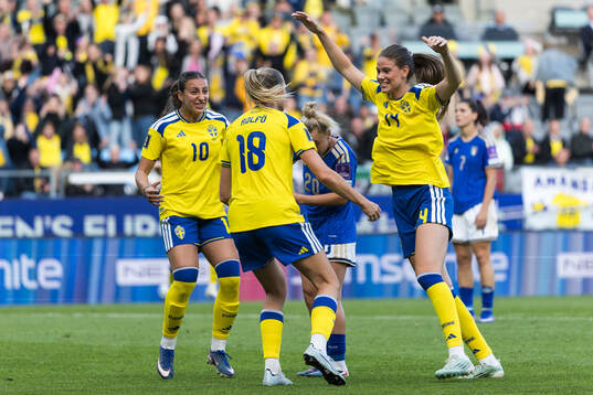Fridolina Rolfö of Sweden celebrates with Rosa Kafaji and