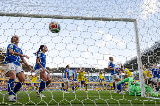 Fridolina Rolfö of Sweden scores 2-2 behind goalkeeper