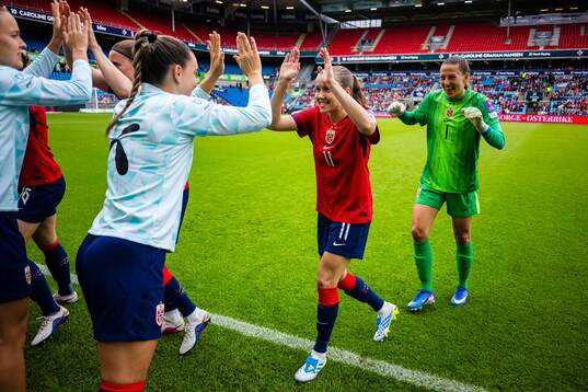Guro Reiten and goalkeeper Cecilie Fiskerstrand of Norway
