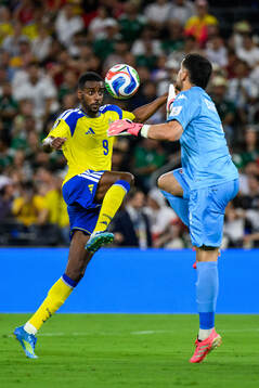 Alexander Isak of Sweden and goalkeeper Mouhib Chamakh of