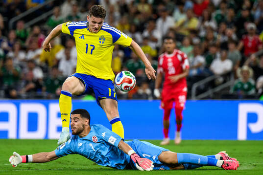 Viktor Gyökeres of Sweden and goalkeeper Mouhib Chamakh of