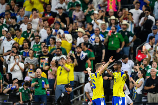 Jesper Karlström and Alexander Isak of Sweden celebrate