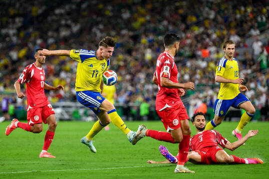 Viktor Gyökeres of Sweden against Montassar Talbi of