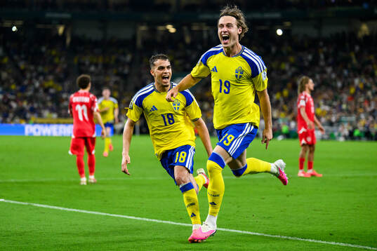 Yasin Ayari and Mattias Svanberg of Sweden celebrate