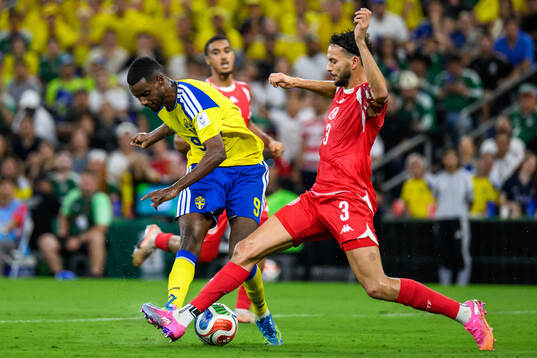 Alexander Isak of Sweden and Montassar Talbi of Tunisia