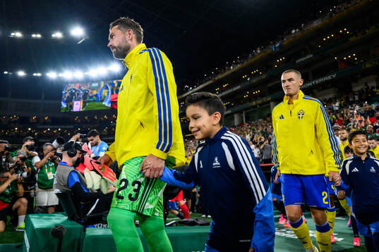 goalkeeper Kristoffer Nordfeldt and Gustaf Lagerbielke of