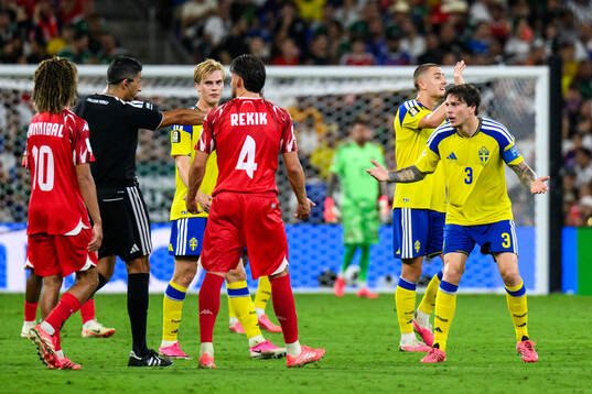 Victor Nilsson Lindelöf of Sweden and Referee Yael Falcon