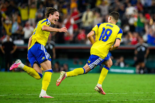 Mattias Svanberg and Yasin Ayari of Sweden celebrate