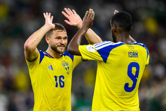 Jesper Karlström and Alexander Isak of Sweden celebrate