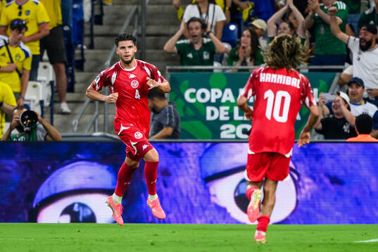 Omar Rekik of Tunisia celebrates