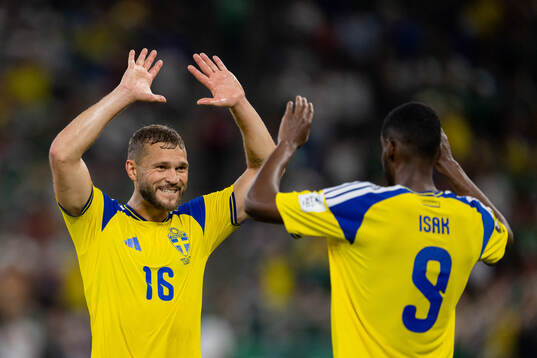 Jesper Karlström and Alexander Isak of Sweden celebrate