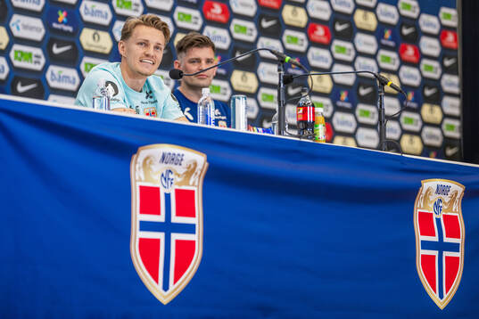 Martin Ødegaard and press officer Morten Morisbak
