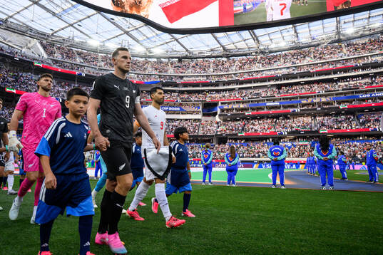 goalkeeper Max Crocombe and Chris Wood of New Zealand and