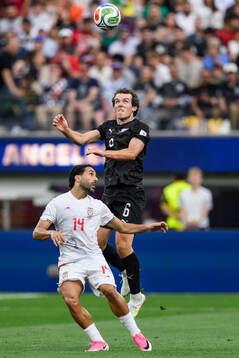 Saman Ghoddos of Iran and Joe Bell of New Zealand