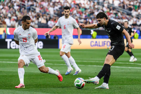 Ali Nemati of Iran and Liberato Cacace of New Zealand