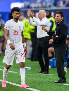 Ramin Rezaeian and Head coach Amir Ghalehnoy of Iran