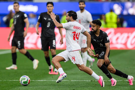 Saman Ghoddos of Iran and Sarpreet Singh of New Zealand