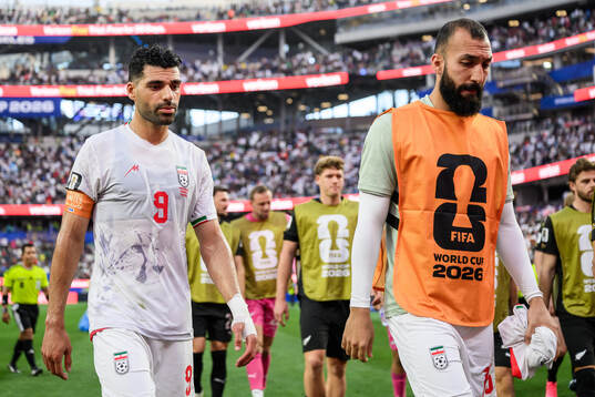 Mehdi Taremi and Ali Nemati of Iran in half time