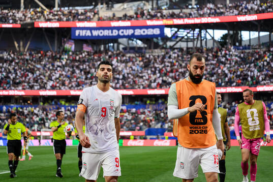 Mehdi Taremi and Ali Nemati of Iran in half time