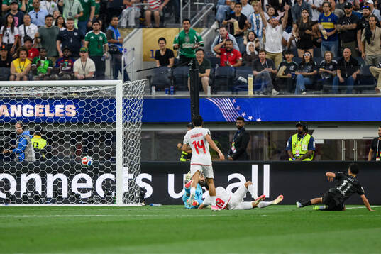 goalkeeper Alireza Beiranvand of Iran concedes the 1-2 goal