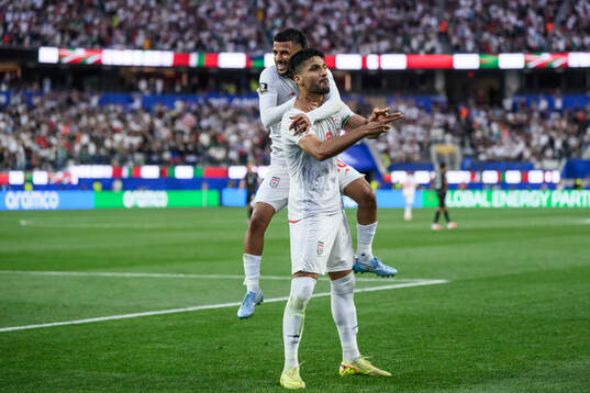 Mehdi Ghayedi and Mohammad Mohebbi of Iran celebrate