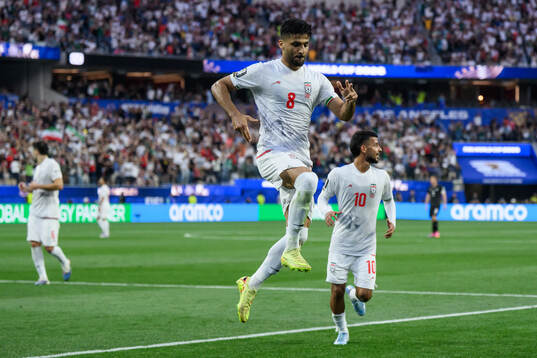 Mohammad Mohebbi of Iran celebrates