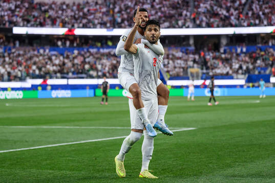 Mehdi Ghayedi and Mohammad Mohebbi of Iran celebrate