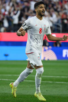 Mohammad Mohebbi of Iran celebrates