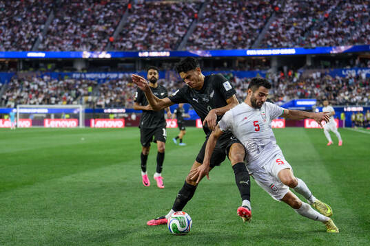 Marko Stamenic of New Zealand and Milad Mohammadi of Iran